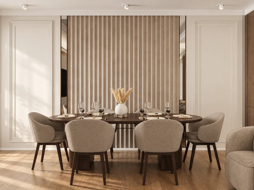 AD Flat dining area with an oval table, upholstered chairs and a fluted feature wall