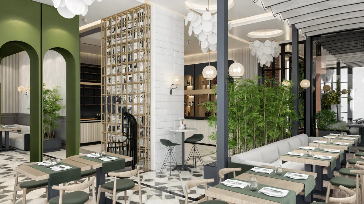 Green arches and a timber screen divide seating areas at Oasis Cadde Café
