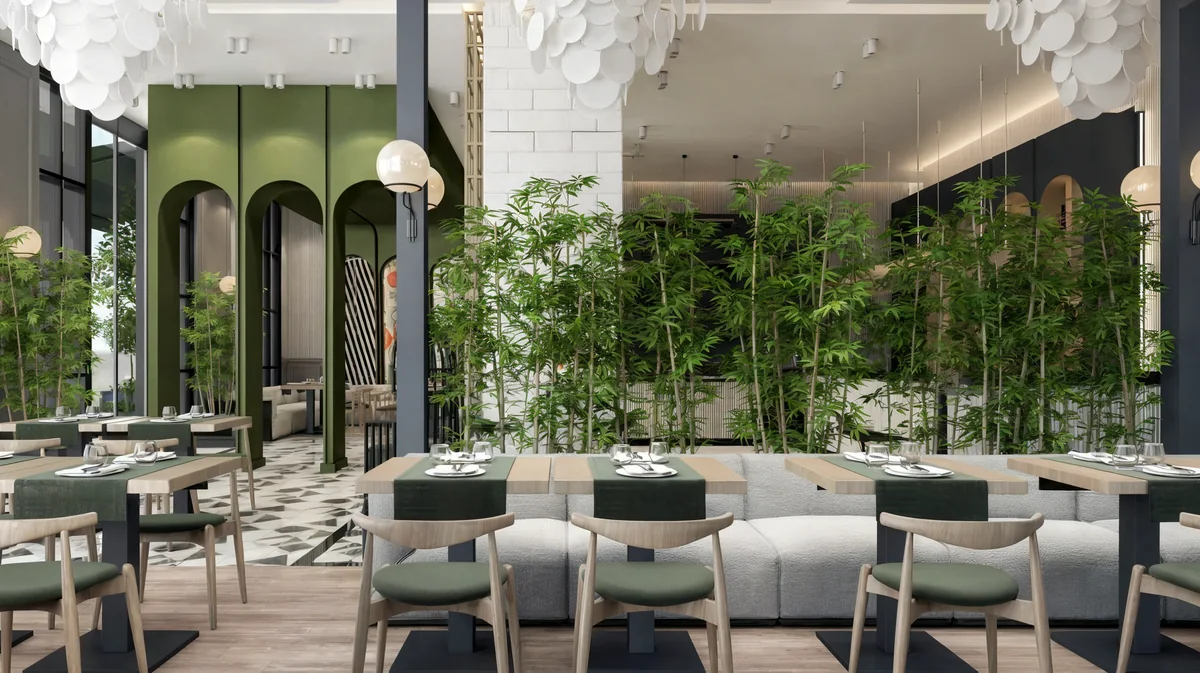 Oasis Cadde Café seating with a bamboo partition and green arched openings