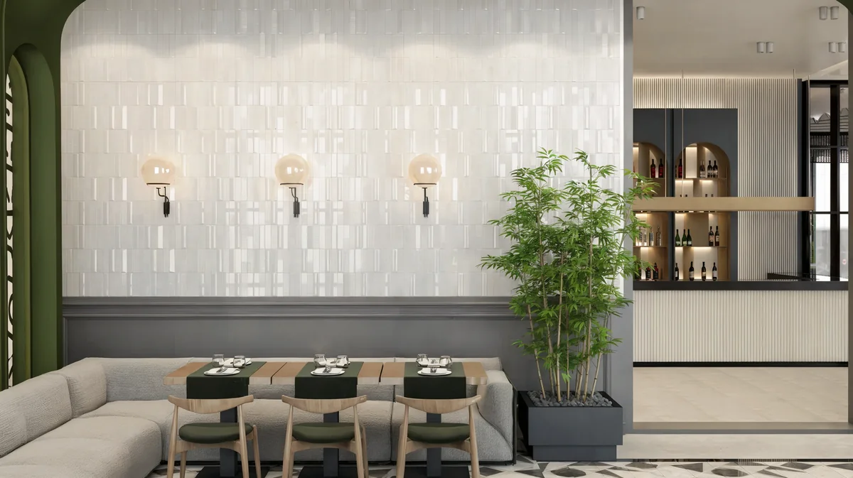Corner banquette and globe wall lights at Oasis Cadde Café