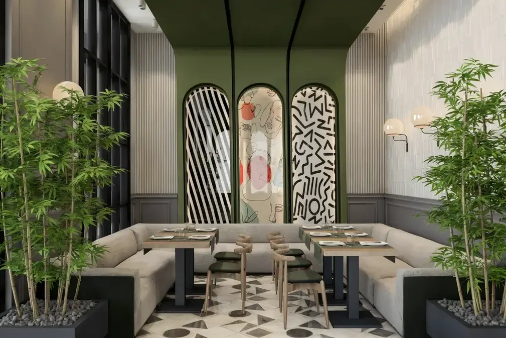 Oasis Cadde Café lounge with arched artwork and bamboo planters