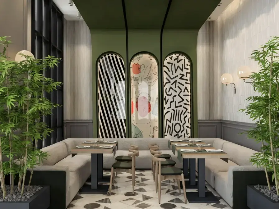 Kemerli sanat eserleri ve bambu saksılarıyla Oasis Cadde Café salonu
