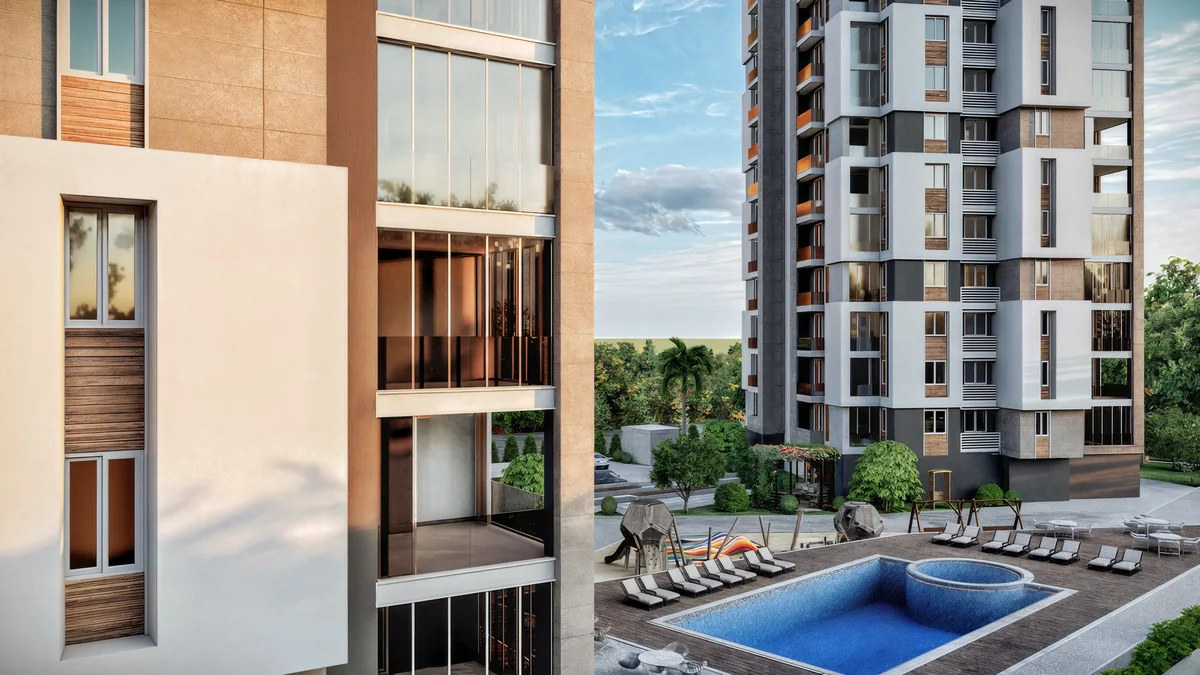 Doğa pool with a circular annex, poolside chairs and residential balconies above