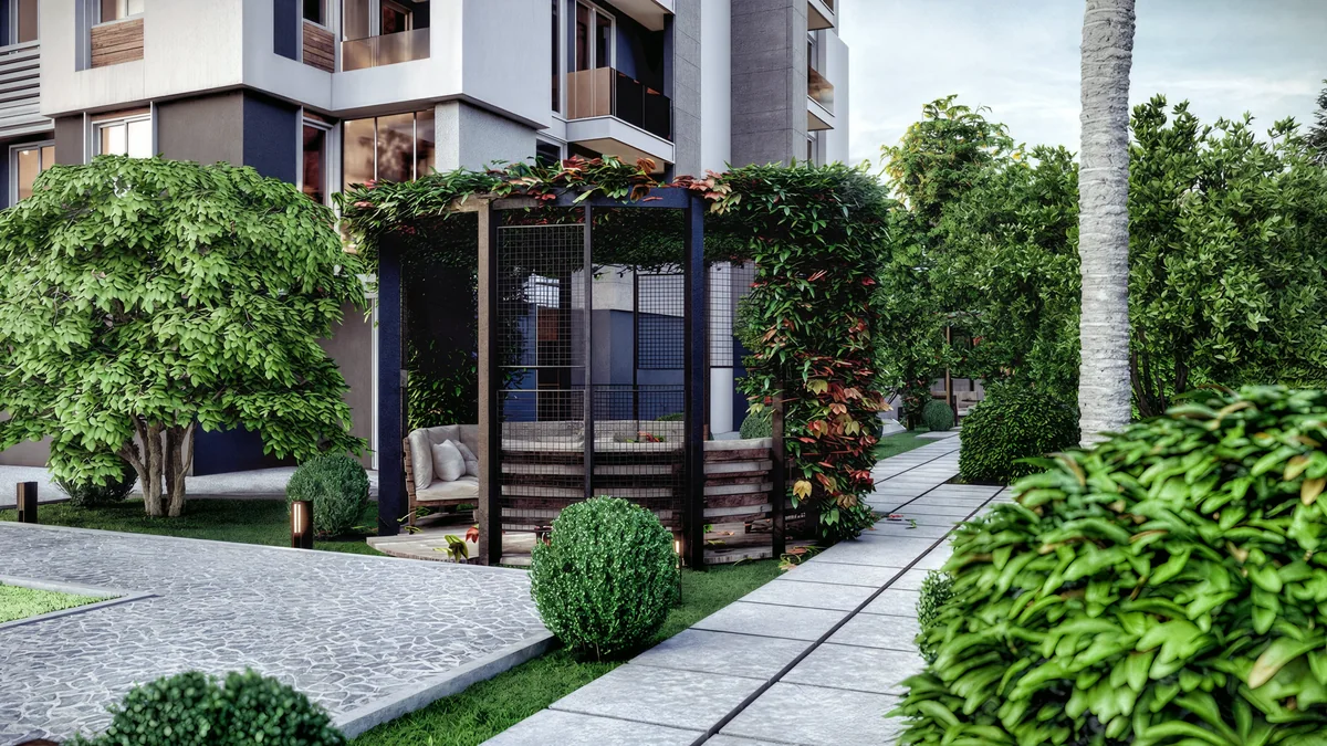 Doğa garden pergola with seating, climbing plants and a paved path