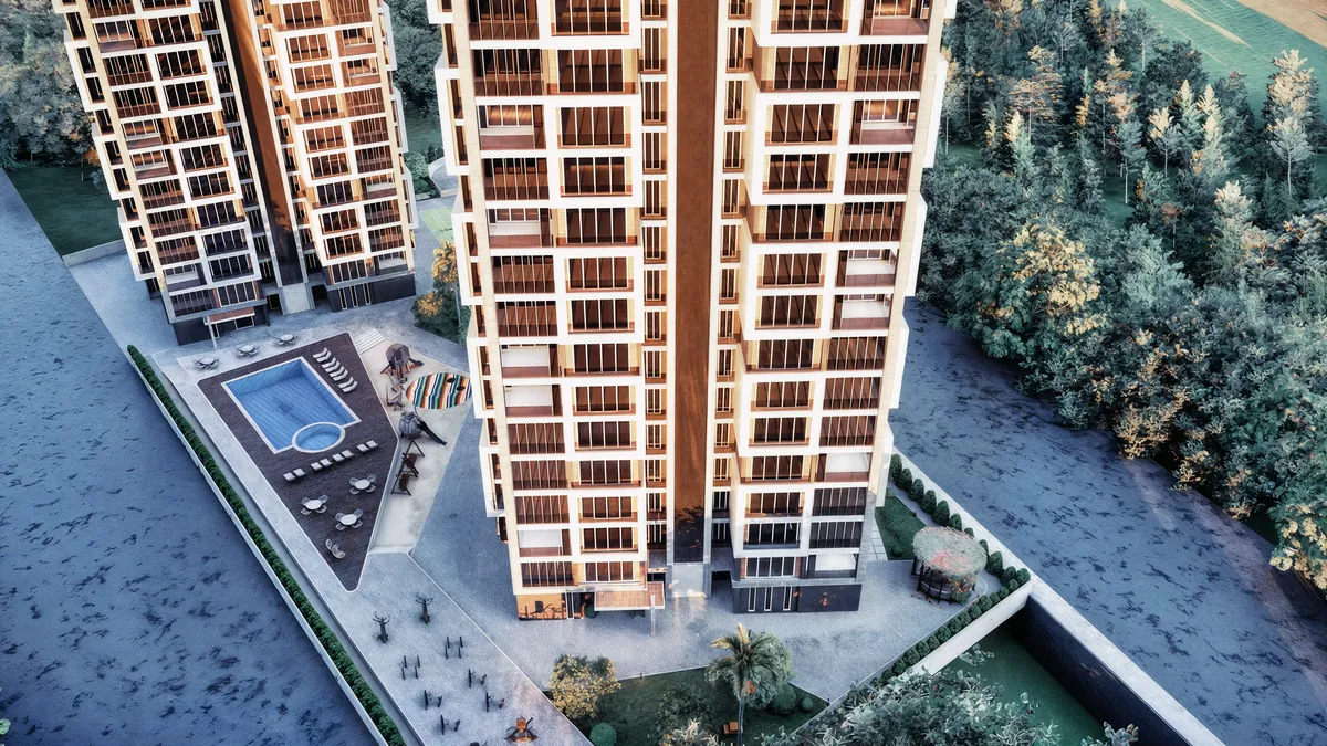 Elevated view of a Doğa tower with the second block, pool and parking beyond
