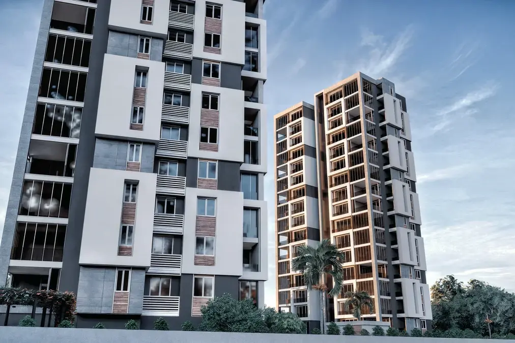 Two Doğa residential towers with white projecting frames and glazed balconies