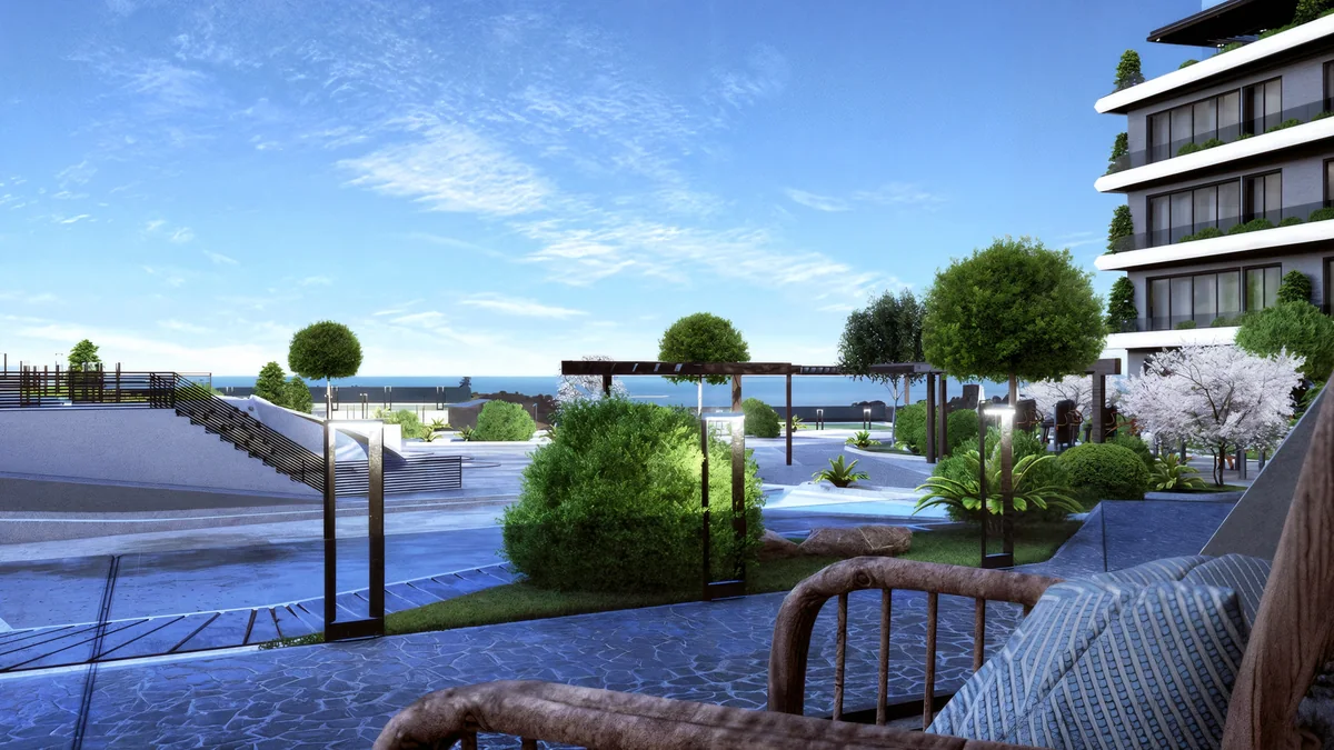 Cennet Yalova terrace view toward planted paths, a pergola and the shared courtyard