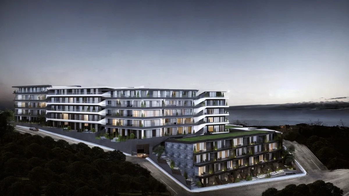 Cennet Yalova aerial perspective showing stepped residential blocks and a planted lower roof