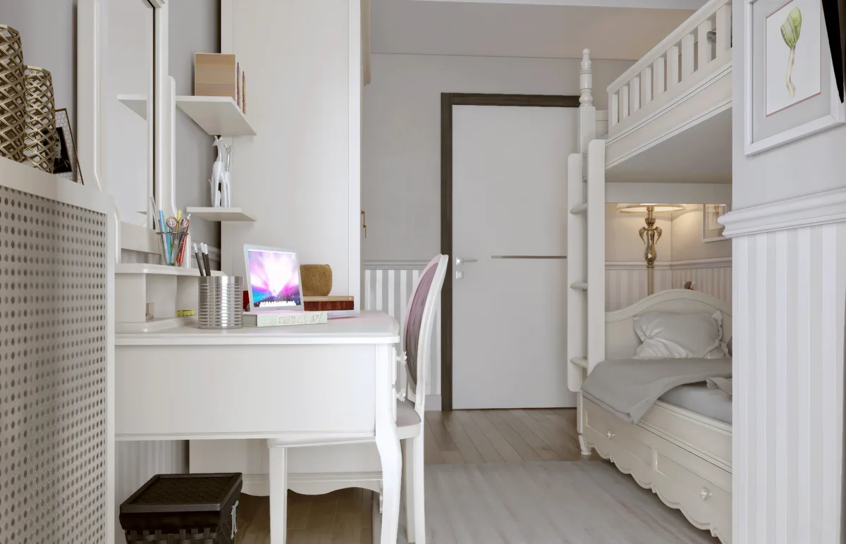 Merter children’s room with a white study desk beside a bunk bed