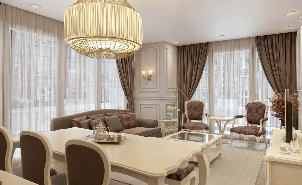 Merter dining table overlooking the living room, floral armchairs and draped windows