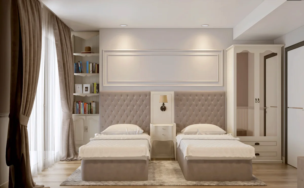 Merter Platform twin bedroom with upholstered headboards, white cabinetry and full-height curtains