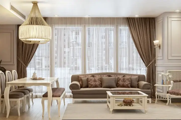 Merter Platform living room with beige seating, white furniture and tall draped windows