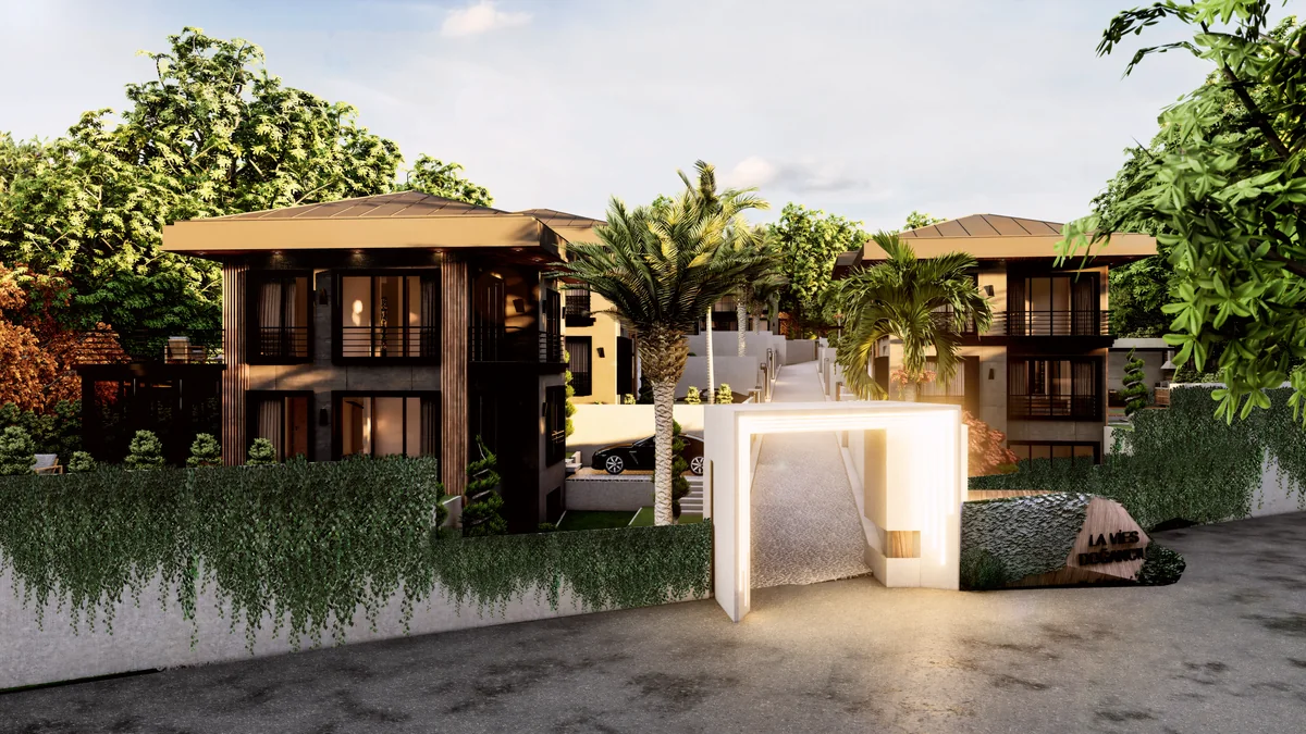 Lavies Şile compound entrance with an illuminated portal, planted boundary walls and an internal access lane