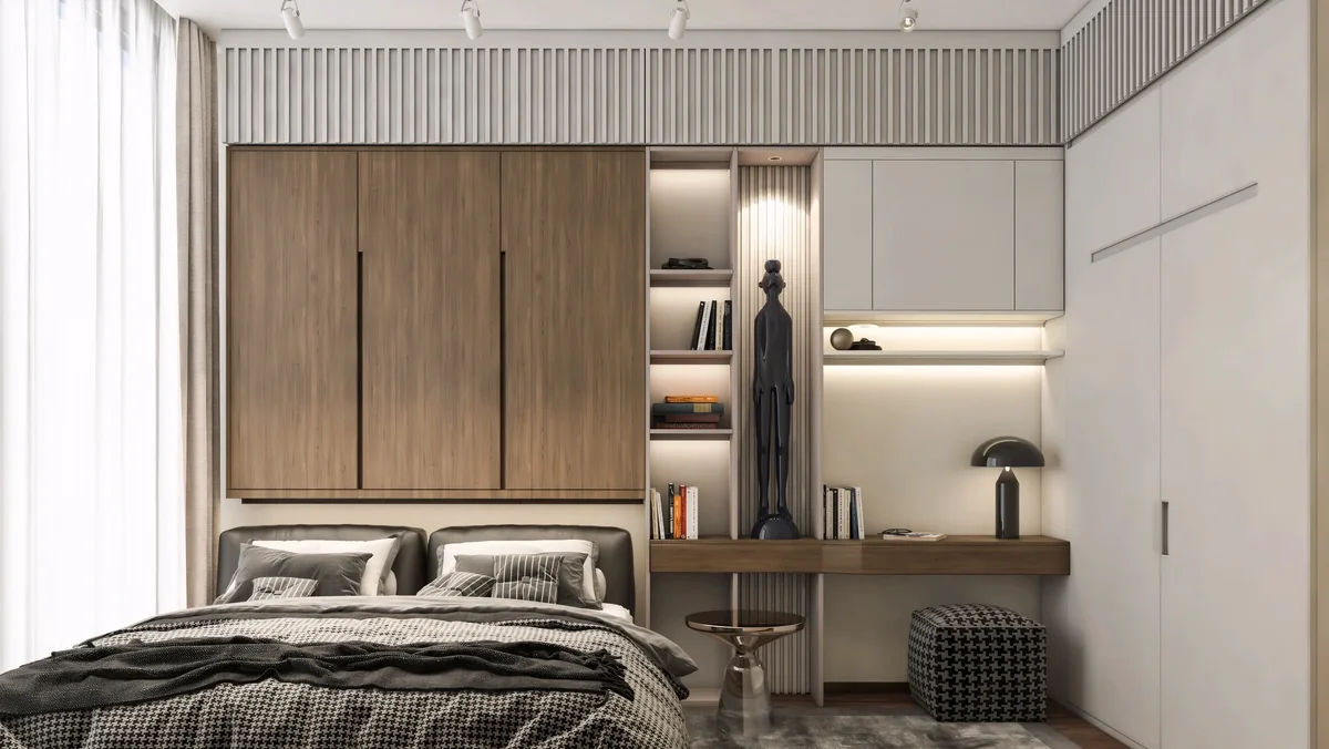 Timber overhead storage and a lit desk niche beside a compact bedroom bed