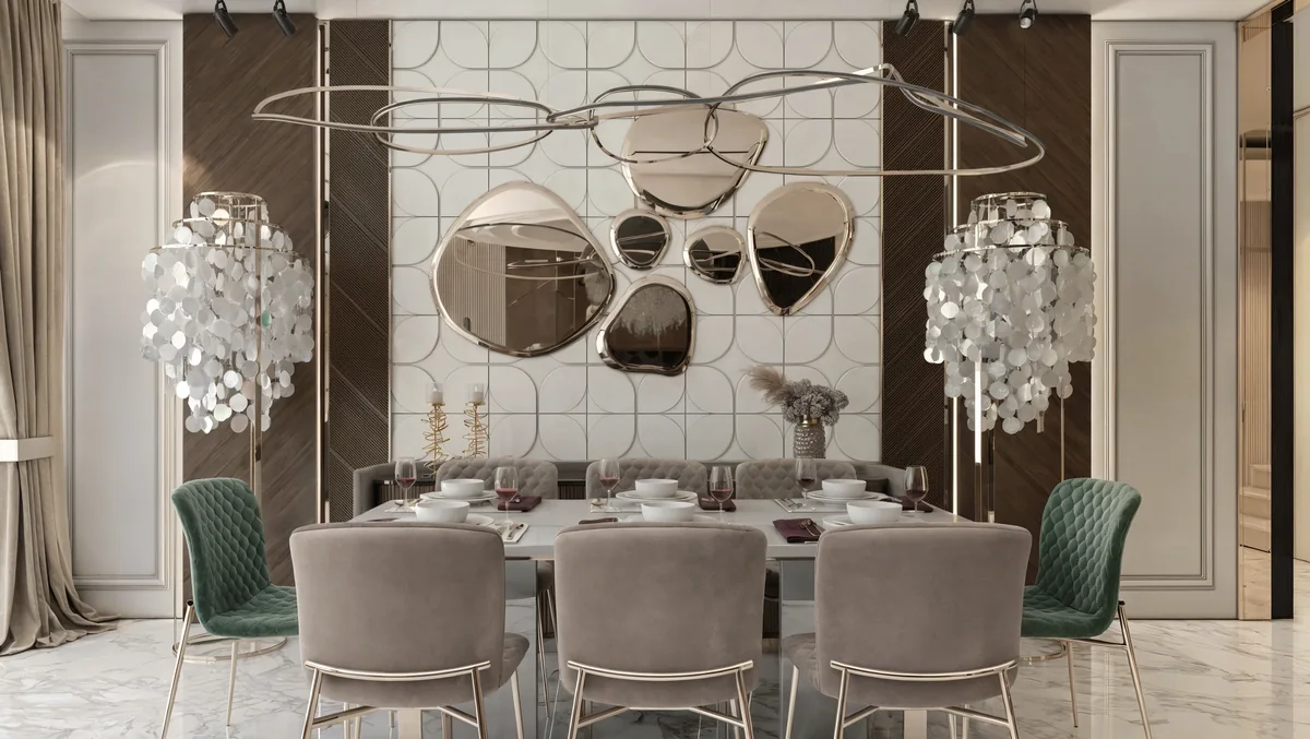 TUTKU villa dining room with a white table, green accent chairs and rounded wall mirrors