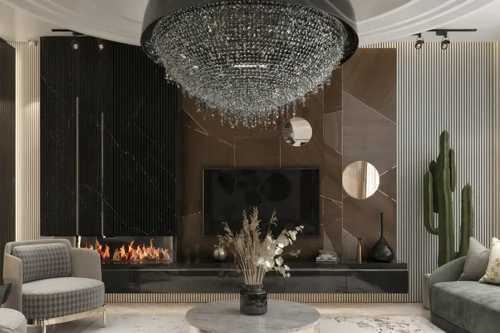 Black marble fireplace and geometric walnut television wall beneath a crystal pendant