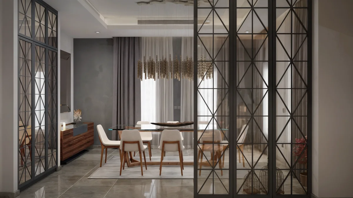 Black geometric glazing frames the dining room at Dahlan Villa in Jeddah