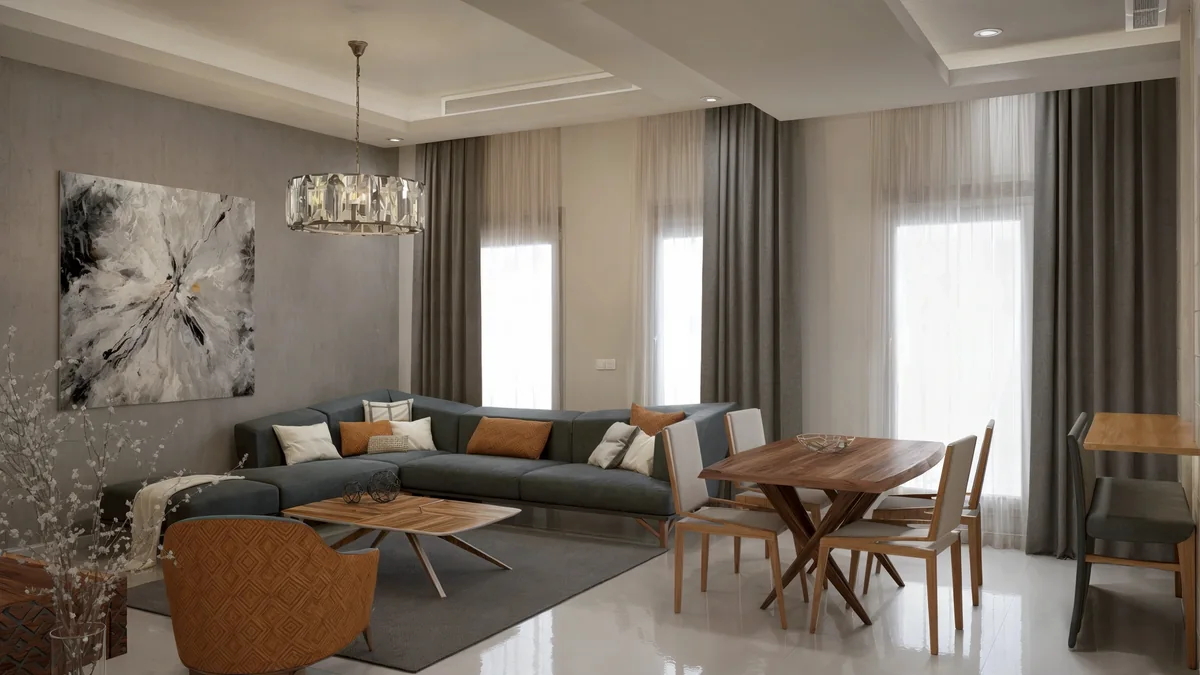 Blue-grey sectional seating and a timber dining table in the Dahlan Villa family living area