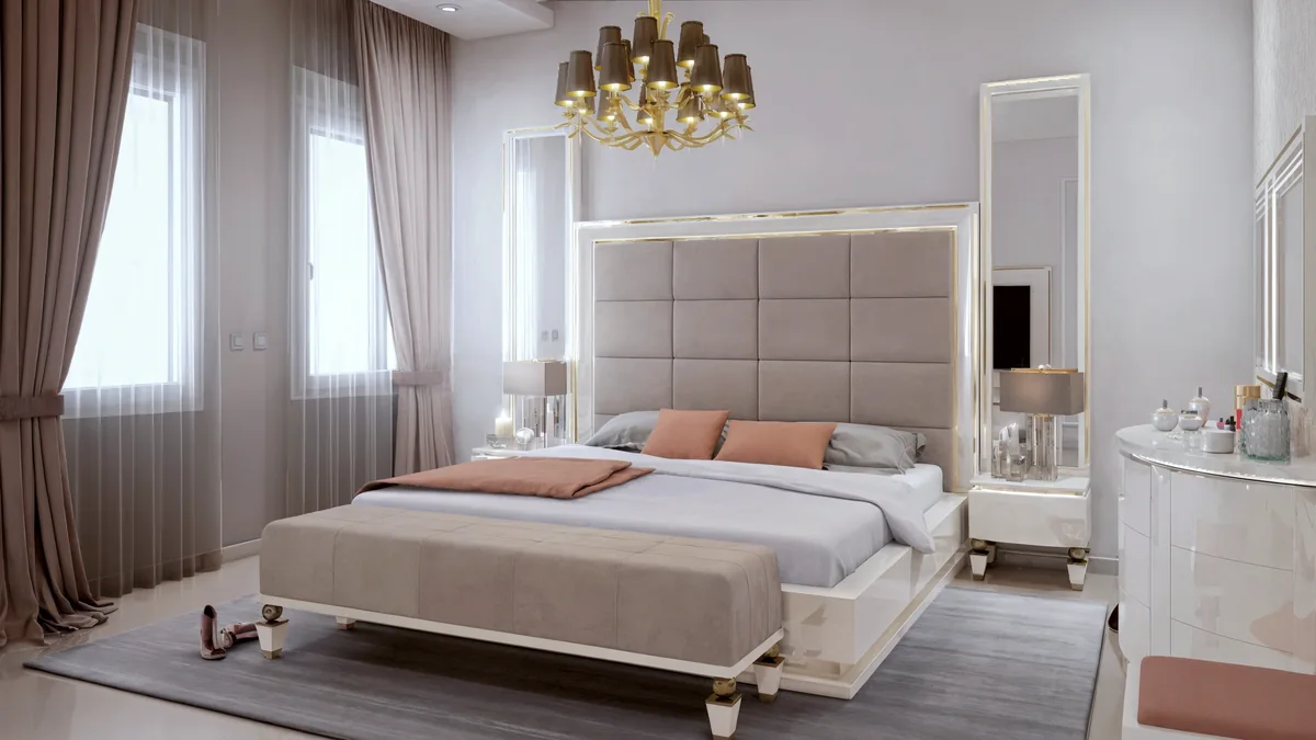 Dahlan Villa formal bedroom with an upholstered headboard, mirrored panels and warm metal details