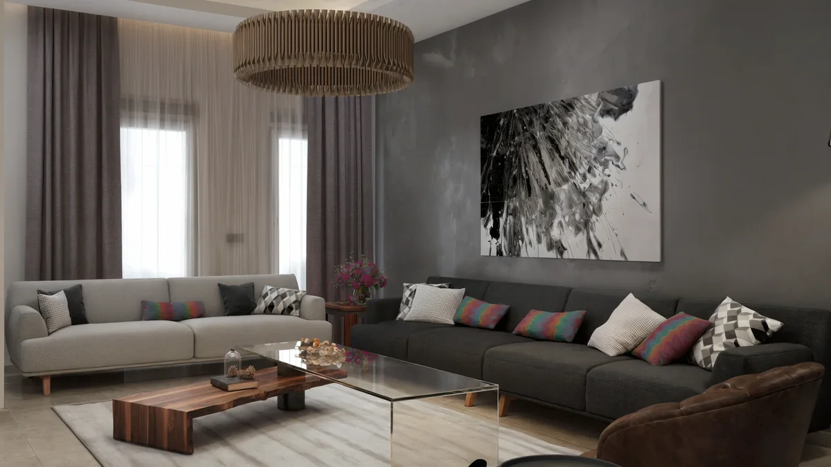 Dahlan Villa reception room with contrasting sofas, layered glass and timber tables and a circular pendant